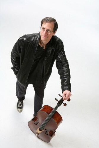 Andy Bryenton standing next to cello